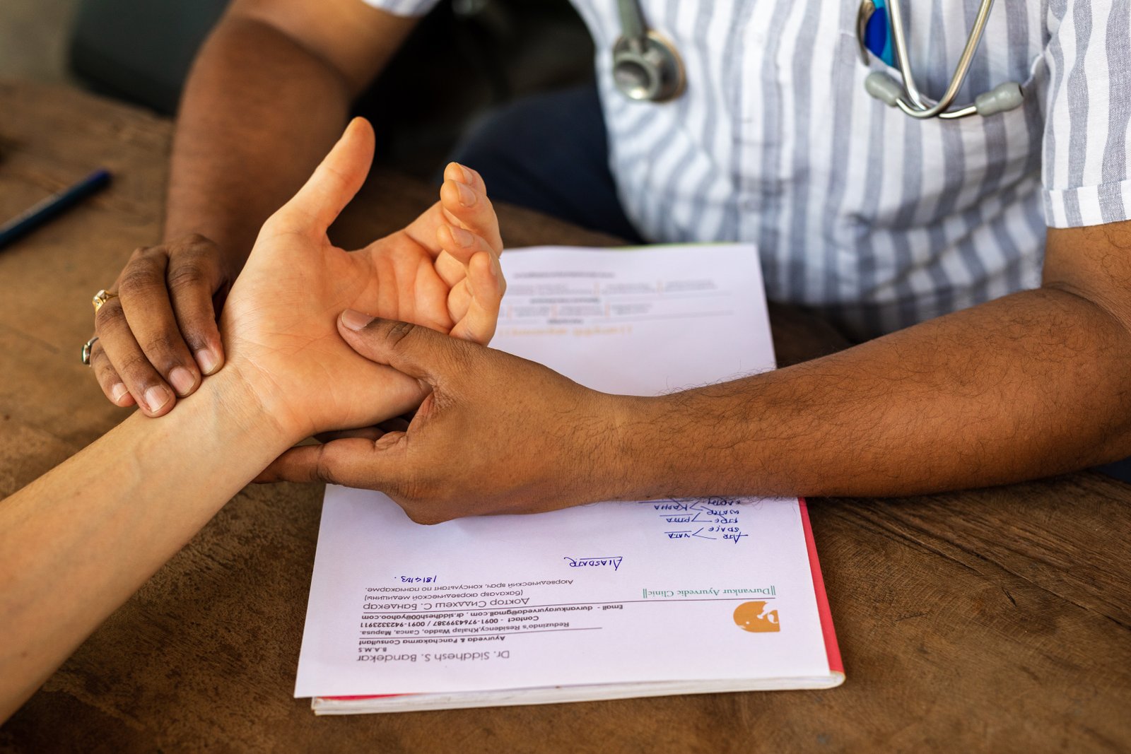 Pulse diagnosis during a consultation with an Ayurvedic doctor at SWAN