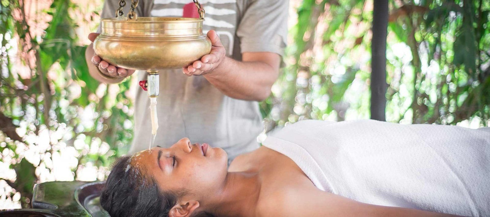 Shirodhara — warm oil poured in a steady stream over the forehead — at SWAN Ayurveda, Goa