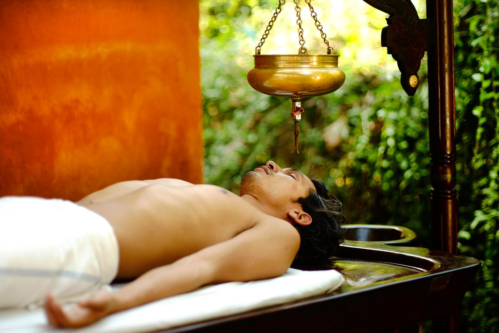 Shirodhara — warm oil poured in a steady stream — during a Panchakarma course at SWAN Ayurveda