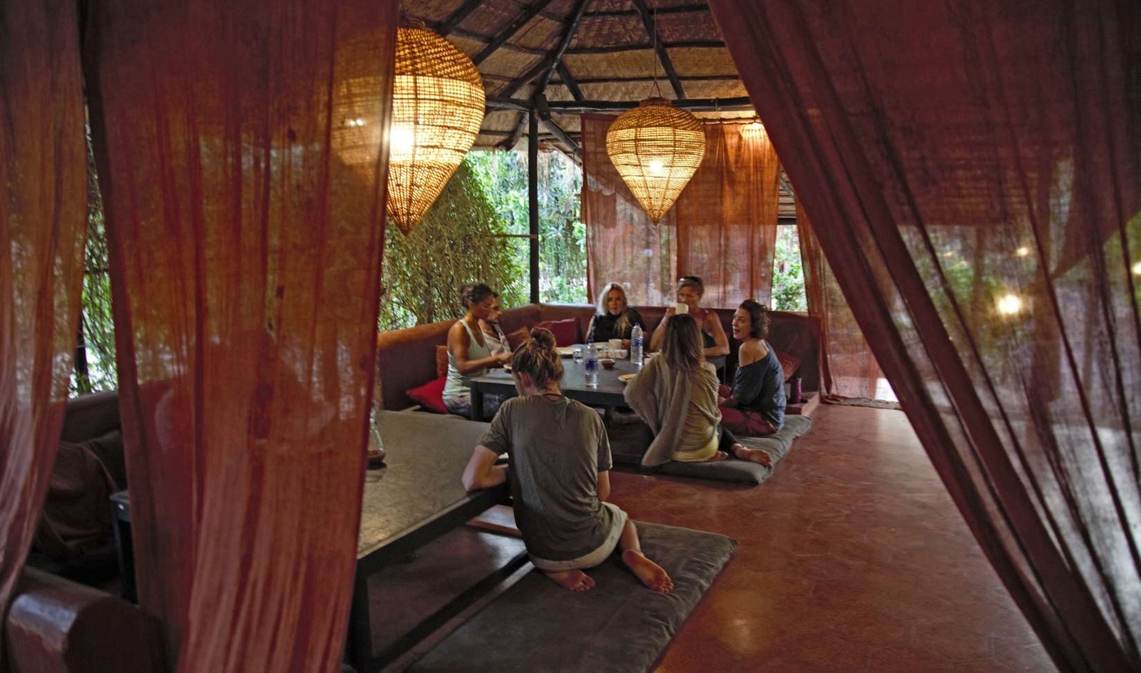 Guests sharing a meal together at SWAN Yoga Retreat, Goa